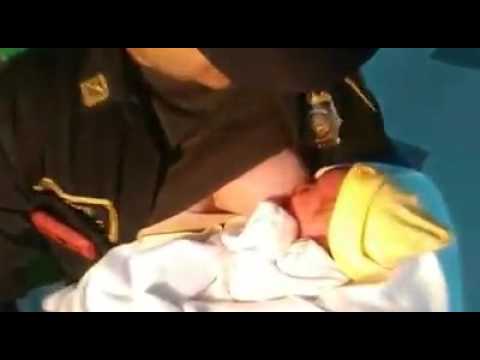 Colombian Cop Nursing Abandoned Newborn